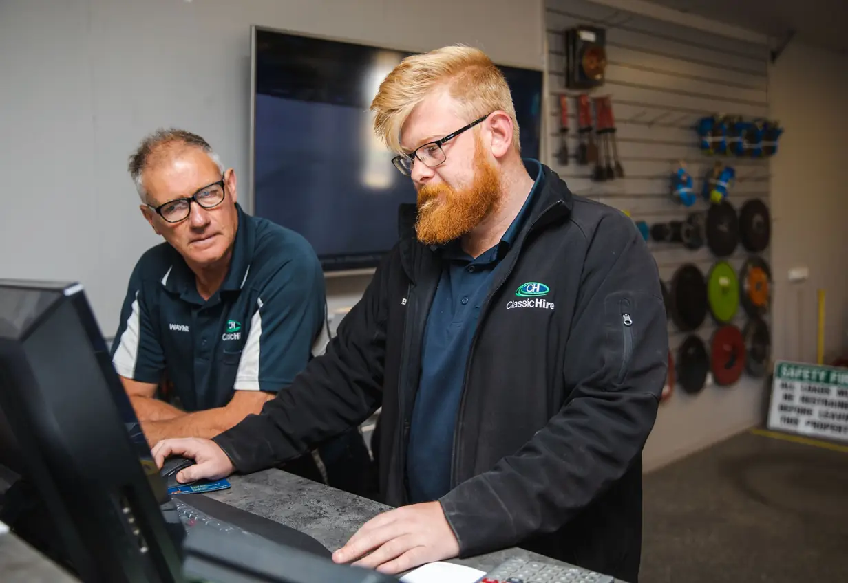 Classic Hire team members working together at the branch counter